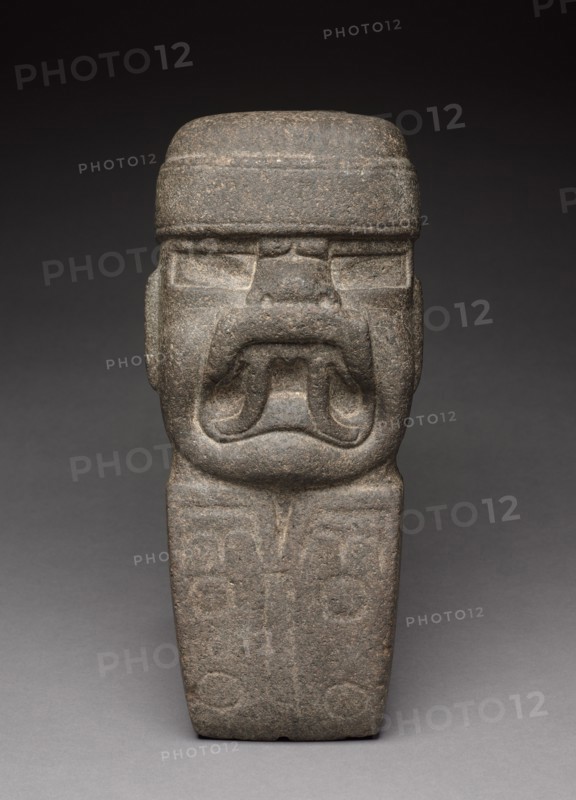 Celt with Deity, 1000-300 BC. Mexico, Olmec, 1200-300 BC. Stone; overall: 32.2 x 14 x 11.5 cm (12 11/16 x 5 1/2 x 4 1/2 in.).