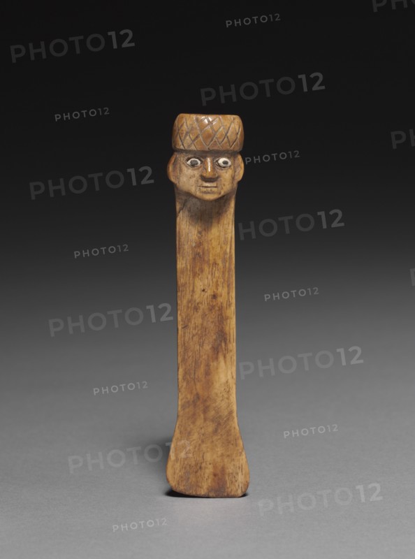 Spatula with Carved Head, 500-900. Peru, Wari style (500-900). Bone with shell inlay; overall: 11.2 x 2.6 cm (4 7/16 x 1 in.).