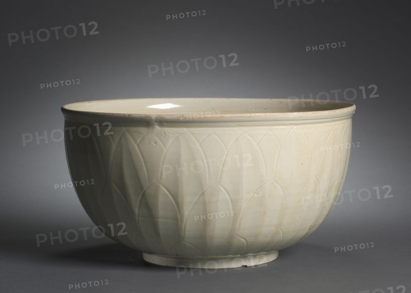 Basin, 1100s-1200s. China, Hebei province, Quyang, Jin dynasty (1115-1234). Cream-glazed porcelain with incised decoration, Ding ware; overall: 15.6 x 30.2 cm (6 1/8 x 11 7/8 in.).