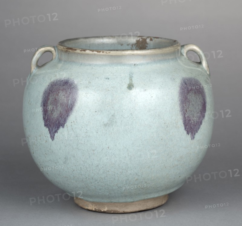 Two-Eared Jar, 1200s-1300s. China, Henan province, Yuxian, Jin dynasty (1115-1234) - Yuan dynasty (1271-1368). Porcelaneous stoneware with blue glaze and splashes of purple, Jun ware; diameter: 12.1 cm (4 3/4 in.); overall: 16.4 cm (6 7/16 in.).