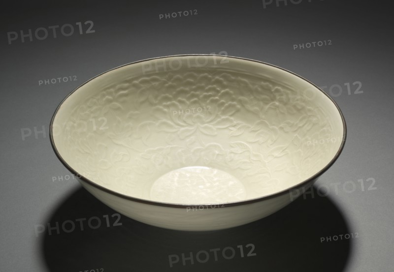 Large Bowl with Peony Scrolls, 1100s. China, Hebei province, Quyang, Jin dynasty (1115-1234). Cream-glazed porcelain with molded design and copper-bound mouth rim, Ding ware; diameter: 26 cm (10 1/4 in.); overall: 8.6 cm (3 3/8 in.).