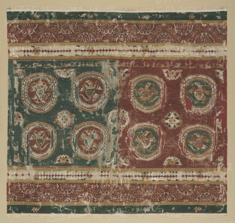 Pillow cover with Arabic inscription, 800s. Egypt, al-Bahnasa. Tapestry weave: wool and linen; mounted: 93.3 x 95.9 cm (36 3/4 x 37 3/4 in.); overall: 80 x 83.2 cm (31 1/2 x 32 3/4 in.)