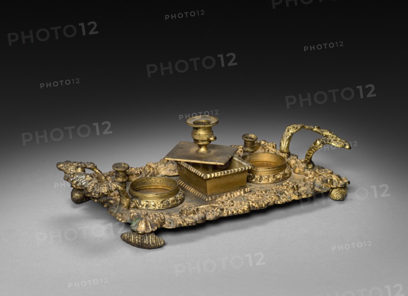 Inkwell, 1825-1850. England or America, 19th century. Gilt bronze and glass; overall: 7 x 24.8 x 13.4 cm (2 3/4 x 9 3/4 x 5 1/4 in.).