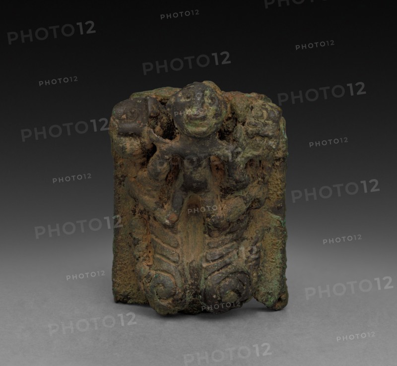 Man and Two Tigers, 1023 - c. 900 BC. China, Zhou dynasty (c. 1046-256 BC). Bronze; overall: 3.9 cm (1 9/16 in.).