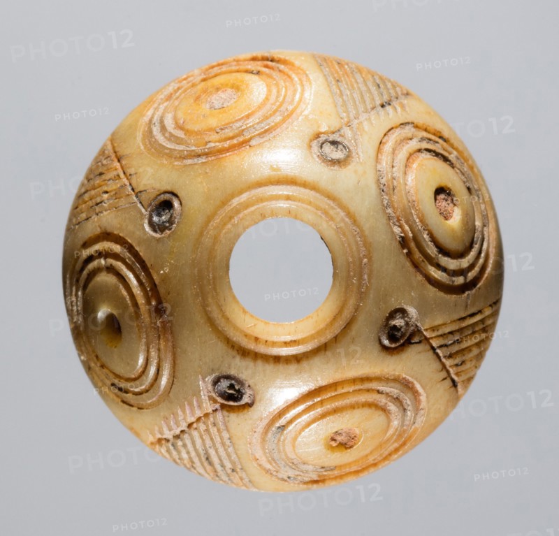 Spindle Whorl, 700s - 900s. Iran, early Islamic period, 8th - 10th century. Bone, incised; overall: 1 x 1.9 x 1.9 cm (3/8 x 3/4 x 3/4 in.)