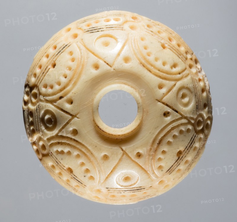 Spindle Whorl, 8th-10th century. Iran, early Islamic period, 8th-10th century. Bone, incised; overall: 0.8 x 2.2 x 2.2 cm (5/16 x 7/8 x 7/8 in.)