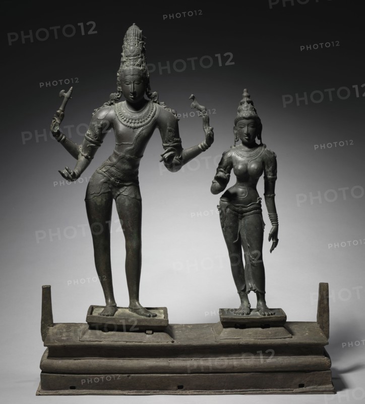 Shiva and Parvati, c. 950-960. South India, Tamil Nadu, Chola period (900-13th Century). Bronze; base: 21.6 x 79.5 x 24.9 cm (8 1/2 x 31 5/16 x 9 13/16 in.); part 1: 81.9 x 48.7 cm (32 1/4 x 19 3/16 in.); part 2: 65.1 x 16.5 cm (25 5/8 x 6 1/2 in.).