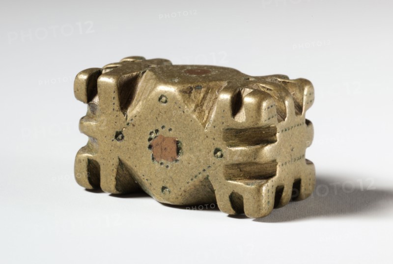Gold Weight:  Geometric, 1800s. Guinea Coast, Ghana, Asante, 19th century. Brass, bronze; overall: 2.4 x 1.4 x 1.2 cm (15/16 x 9/16 x 1/2 in.)