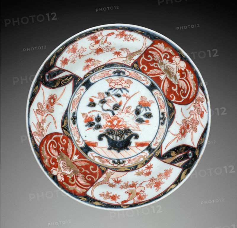 Plate with Vase of Peonies: Imari Ware, c. 1700. Japan, Saga Prefecture, Arita Kilns, Edo Period (1615-1868). Porcelain with decoration in underglaze blue overglaze, and gold; diameter: 24.8 cm (9 3/4 in.); overall: 4.2 cm (1 5/8 in.).