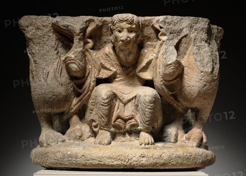 Engaged Capital with a Supporting (Caryatidal) Figure Flanked by Lions, c. 1125-1150. Western France, Vendée or Angoulême?, 12th century. Limestone; overall: 34.3 x 47 x 34.3 cm (13 1/2 x 18 1/2 x 13 1/2 in.).