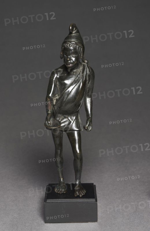 Statuette of a Beggar, 100-50 BC. Greece, Greco-Roman Period, late Ptolemaic Dynasty. Bronze, solid cast, with silver and copper inlays; overall: 18.4 x 5.3 x 7.2 cm (7 1/4 x 2 1/16 x 2 13/16 in.).
