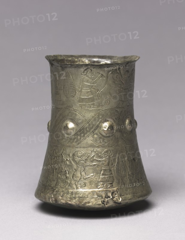 Hero and Animal Combat Beaker, 900-700 BC. Iran, Luristan, 9th-7th Century BC. Silver, repoussé, engraved; diameter: 7.7 cm (3 1/16 in.); overall: 10.1 cm (4 in.).