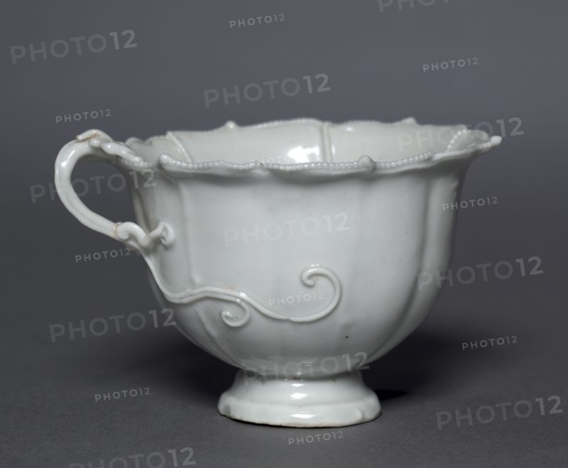Fluted Cup with Dragon Handle, Qingbai Ware, early 14th Century. China, Jiangxi province, Jingdezhen kilns, Yuan dynasty (1271-1368). Glazed porcelain; diameter: 9 cm (3 9/16 in.); overall: 6 cm (2 3/8 in.).