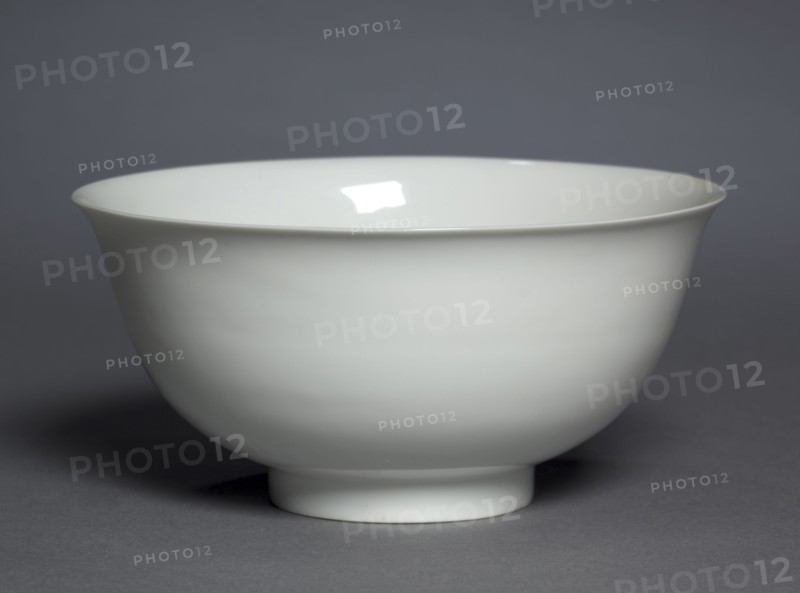 Bowl with Dragons and Clouds, 1403-1424. China, Jiangxi province, Jingdezhen, Ming dynasty (1368-1644), Yongle period (1403-1424). Porcelain with molded and incised decoration and white glaze; diameter: 8.4 x 17.2 cm (3 5/16 x 6 3/4 in.); overall: 8 cm (3 1/8 in.).