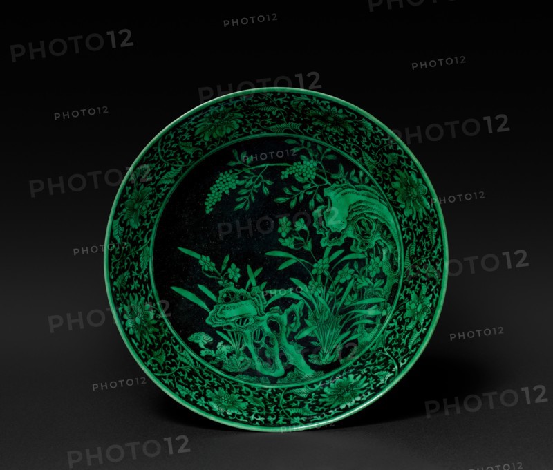 Dish with Narcissus and Rocks (interior); Floral Scrolls (exterior), 1736-1795. China, Jiangxi province, Jingdezhen kilns, Qing dynasty (1644-1912), Yongzheng mark and reign (1722-1735). Porcelain painted in black with green glaze; diameter: 16.8 cm (6 5/8 in.); overall: 4.8 cm (1 7/8 in.).