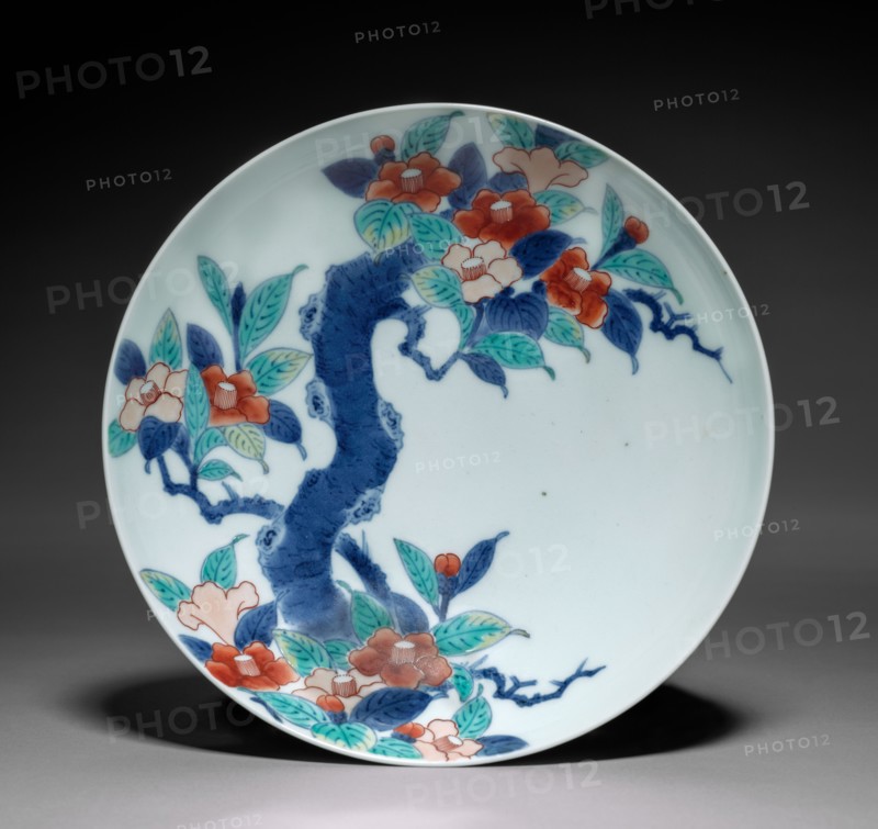 Dish with Branch of Camellia, c. 1688–1716. Japan, Edo period (1615-1868). Porcelain with underglaze blue and overglaze color enamel (Hizen ware, Nabeshima type); diameter: 20.2 cm (7 15/16 in.); overall: 5.8 cm (2 5/16 in.).