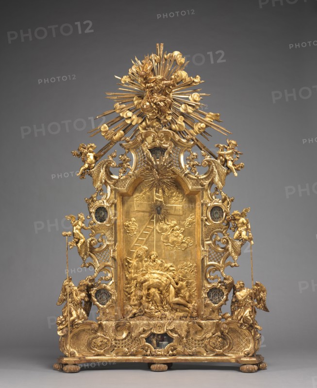 Altarpiece with Relics, c. 1735-1740. And workshop Joseph Matthias Götz (German, 1696-1760). Gilded wood, with relics in niches: gilded wood, mother-of-pearl, ebony, red silk, gold wire, seed pearls, rock crystal, pen and ink on paper; overall: 165.1 x 108 x 20 cm (65 x 42 1/2 x 7 7/8 in.).