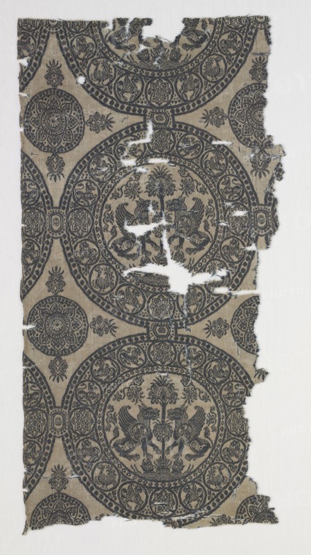 Fragments with Griffins in Roundels, 1100s. Iran or Iraq, Seljuk period, 12th century. Lampas weave, silk; overall: 34.2 x 17 cm (13 7/16 x 6 11/16 in.)