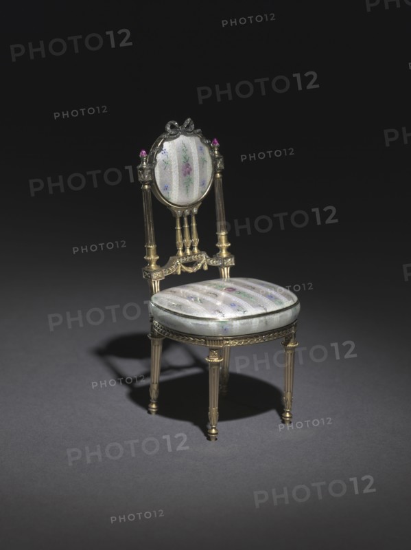 Miniature Chair, 1896-1906. Firm of Peter Carl Fabergé (Russian, 1846-1920). Gold, silver gilt, enamel over engine turned ground simulating brocaded textile, rubies, diamonds; overall: 10.5 x 5.3 x 4.8 cm (4 1/8 x 2 1/16 x 1 7/8 in.).