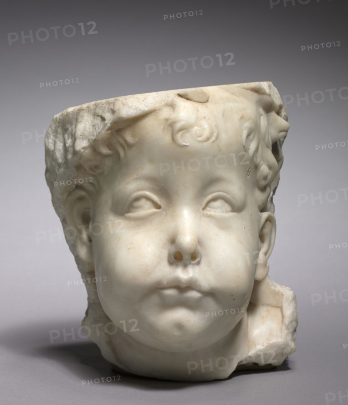 Head of a Putto, 1450-1475. Follower of Desiderio da Settignano (Italian, 1429-32-1464). Marble; overall: 18.5 x 16.2 x 17.5 cm (7 5/16 x 6 3/8 x 6 7/8 in.).