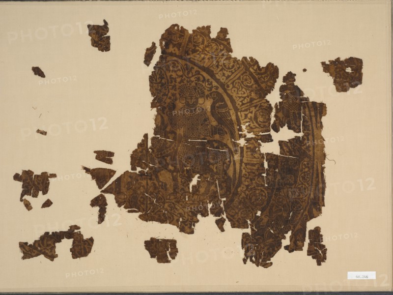 Silk fragment with falconer riding a bull, 1000s-1100s. Iran, Rayy, Seljuk period. Double cloth: silk; overall: 28 x 25.4 cm (11 x 10 in.)
