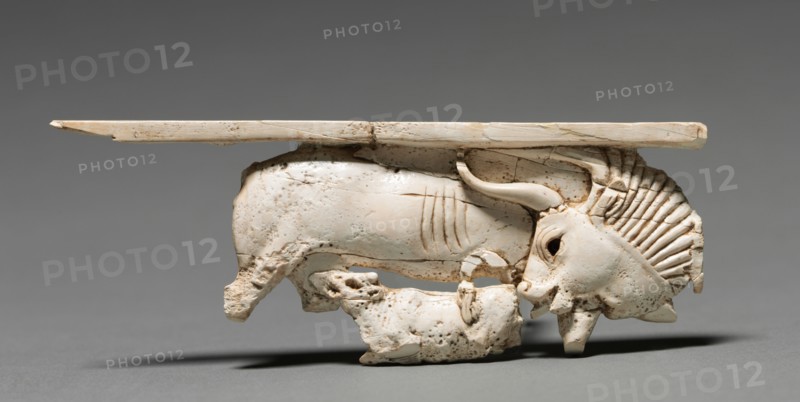 Decorative Plaque: Cow Nursing Its Calf, 900-800 BC. Phoenician, Iraq, Nimrud, 9th-8th Century BC. Ivory; overall: 4.6 x 12.4 cm (1 13/16 x 4 7/8 in.).