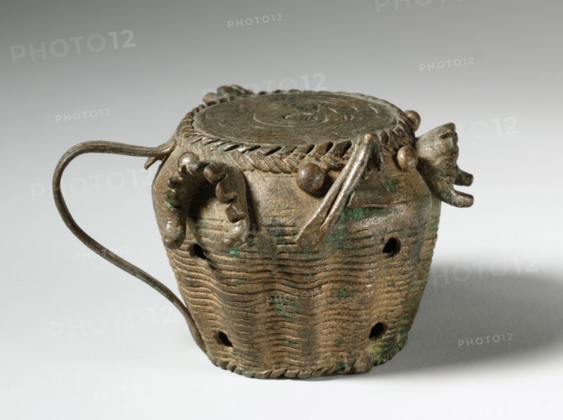 Gold Weight: Drum with Jaws of Defeated Enemies, 1800s. Guinea Coast, Ghana, Asante, 19th century. Brass, bronze; overall: 3.6 x 5.3 cm (1 7/16 x 2 1/16 in.)