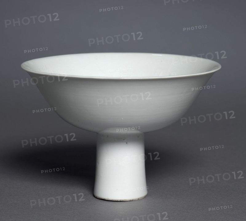 Stem Cup with Buddhist Emblems: Shufu Ware, 1300s. China, Jiangxi province, Yuan dynasty (1271-1368). Porcelain with molded decoration and white glaze; overall: 10.2 x 15.3 cm (4 x 6 in.).