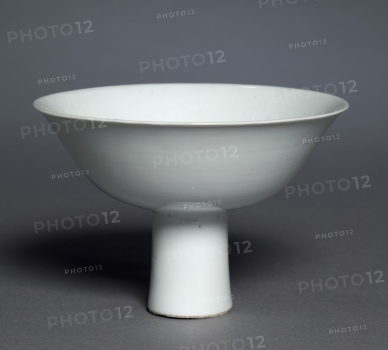 Stem Cup with Buddhist Emblems: Shufu Ware, 1300s. China, Jiangxi province, Yuan dynasty (1271-1368). Porcelain with molded decoration and white glaze; case: 16.6 x 17.8 cm (6 9/16 x 7 in.); overall: 10.2 x 15.3 cm (4 x 6 in.).