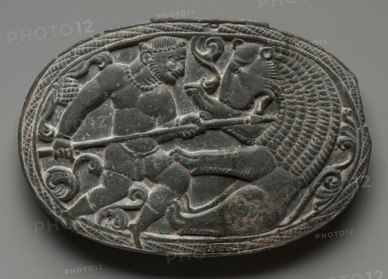 Lid with Combat between a Man and a Lion, c. 200s-300s. Pakistan, Gandhara, late Kushan Period (1st century-320). Steatite; overall: 9.8 x 14.2 cm (3 7/8 x 5 9/16 in.).