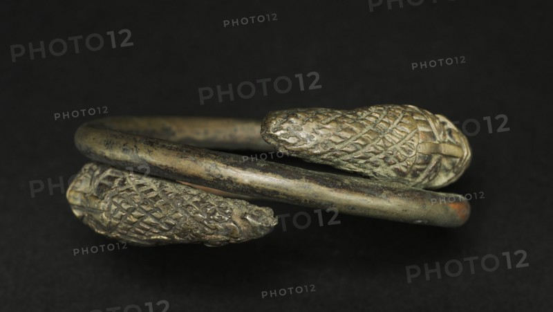 Hand Coil, 1800s. Guinea Coast, Nigeria, Benin, 19th century. Bronze; diameter: 11.5 cm (4 1/2 in.)