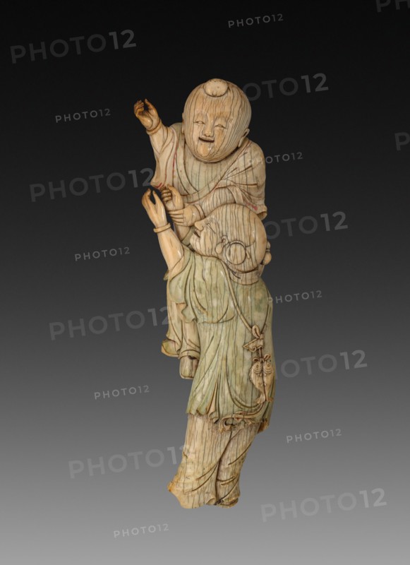 Wall Plaque with Two Boys Playing, 18th century. China, Qing dynasty (1644-1911). Ivory with traces of polychrome; overall: 23.5 cm (9 1/4 in.).