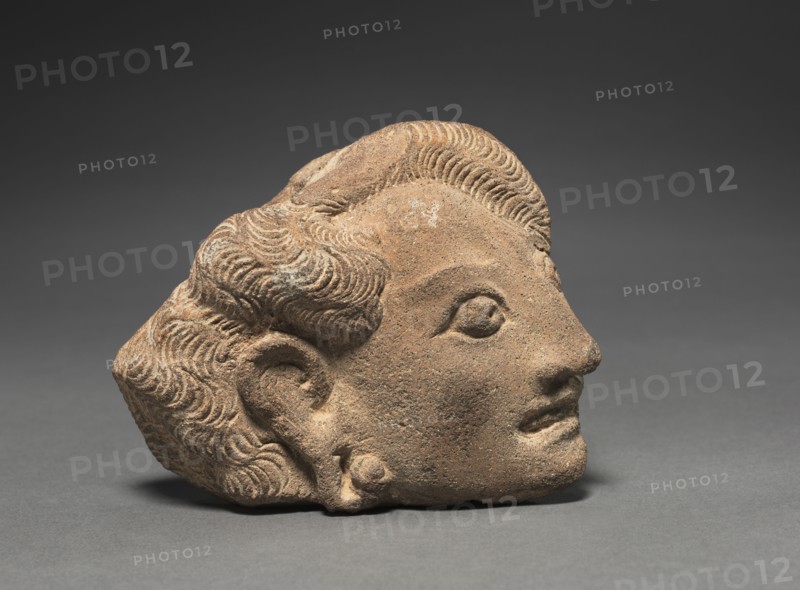 Yakshini's Head, c. 11th Century. Java, Eastern Javanese Period. Terracotta; overall: 10.1 x 11.4 cm (4 x 4 1/2 in.).