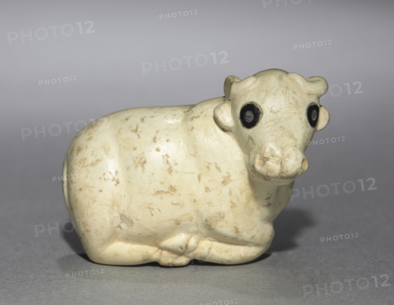 Amulet Seal in the Form of a Bull, c. 3250 BC. Pre-Sumerian, Iraq, C. 3250 BC. Limestone with black stone inlaid eyes; overall: 2.7 x 4.7 x 3.9 cm (1 1/16 x 1 7/8 x 1 9/16 in.).