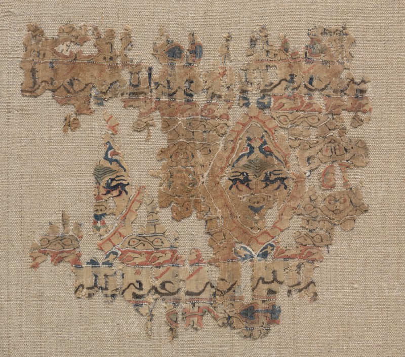 Fragment of a Tiraz-Style Textile, 1100s. Egypt, Fatimid period, 12th century. Tapestry (probably originally inwoven in tabby ground); linen and silk; overall: 14.7 x 16.8 cm (5 13/16 x 6 5/8 in.)