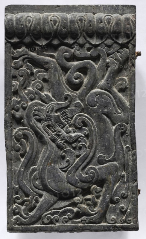 Section of a Coffin Platform: Dragon, 550-577. China, Northern Qi dynasty (550-577). Limestone; overall: 45.7 x 211.4 x 10.8 cm (18 x 83 1/4 x 4 1/4 in.); panel: 45.7 x 26.3 x 10.8 cm (18 x 10 3/8 x 4 1/4 in.).