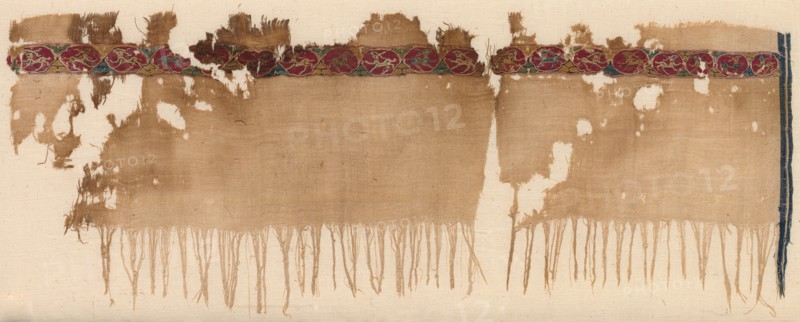 Fragment of a Tiraz, 1080 - 1099. Egypt, Fatimid period, late 11th century. Tabby ground with inwoven tapestry ornament; linen and silk; overall: 19.5 x 52.4 cm (7 11/16 x 20 5/8 in.)