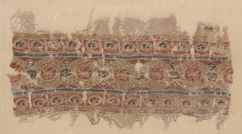 Fragment of a Tiraz-Style Textile, 1100s. Egypt, Fatimid period, 12th century. Tabby ground with inwoven tapestry ornament; linen and silk; overall: 11.5 x 21.4 cm (4 1/2 x 8 7/16 in.)