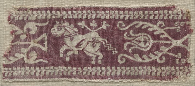 Fragment of a Band with Horse, 700s - 900s. Egypt, Umayyad or Abbasid period (?), 8th - 10th century. Tapestry (originally inwoven in tabby ground); wool and linen; overall: 6.5 x 15.3 cm (2 9/16 x 6 in.).