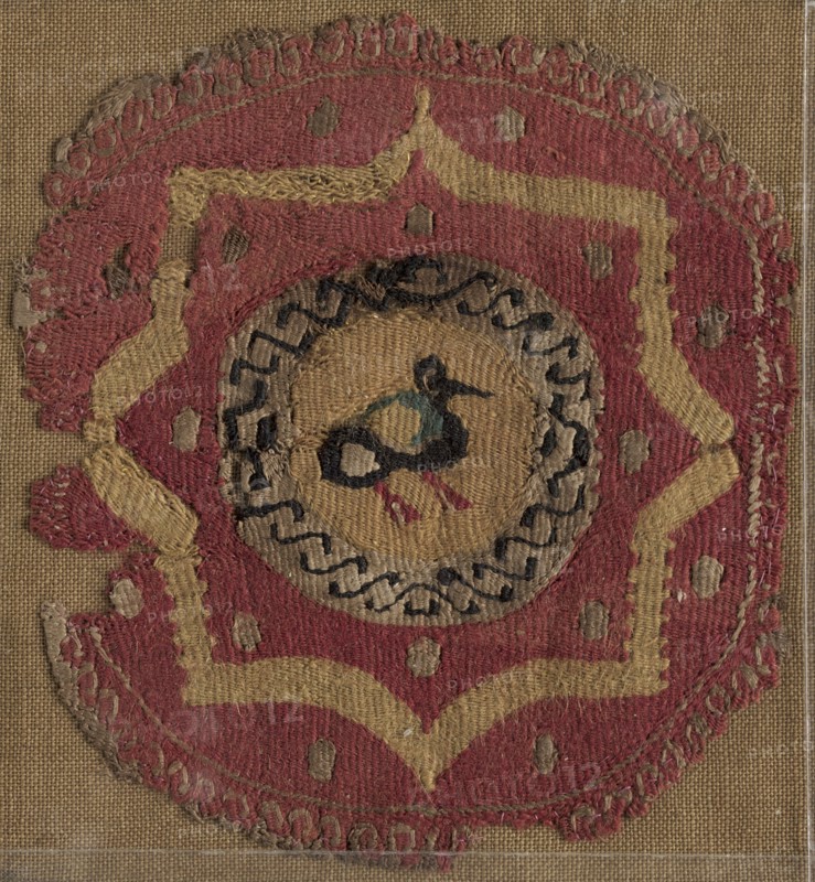 Circular Segmentum with Eight-Pointed Star and Bird, 600s - 700s. Egypt, 7th - 8th century. Tapestry (originally inwoven in tabby ground); linen and wool; overall: 11.5 x 10.5 cm (4 1/2 x 4 1/8 in.)