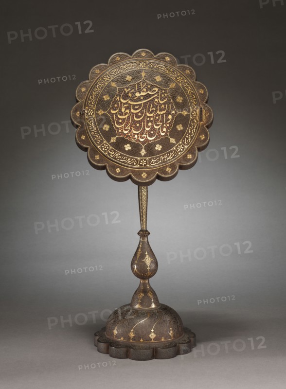 Mirror Stand, 1800s. Iran, Qajar Period, 19th Century. Steel engraved and inlaid with gold and silver with openwork calligraphic design on hinged door; diameter: 25.5 cm (10 1/16 in.); overall: 52.5 cm (20 11/16 in.); diameter of base: 18.6 cm (7 5/16 in.).