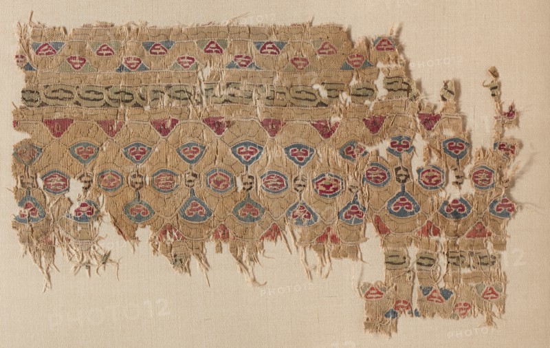 Fragment of a Tiraz-Style Textile, 1100s. Egypt, Fatimid period, 12th century. Tapestry (originally inwoven in a tabby ground); linen and silk; overall: 13.8 x 22.5 cm (5 7/16 x 8 7/8 in.)