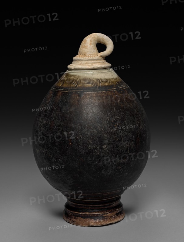 Jar in the Shape of a Fruit, 1100s. Cambodia, Northeast Thai kiln, Khmer Ware, Angkor Wat/Bayon period, 12th century. Glazed pottery with brown slip; diameter: 15.2 cm (6 in.); overall: 24 cm (9 7/16 in.).