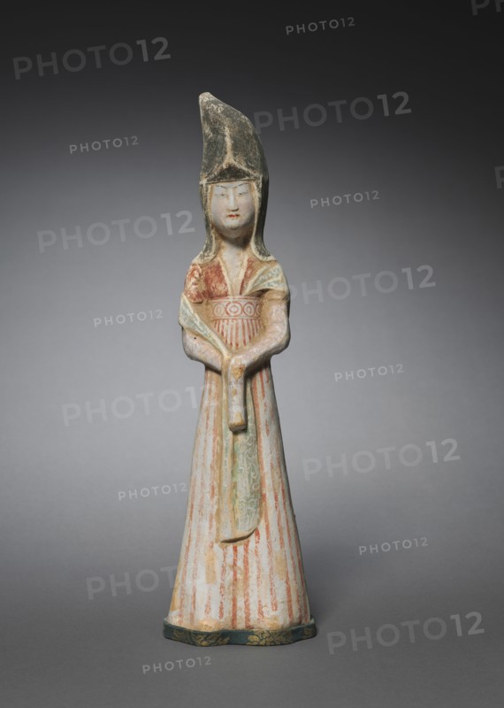 Court Lady with Tall Headdress:  Tomb Figurine, c. 700-750. Norht China, Tang dynasty (618-907). Earthenware with polychromy; overall: 30.8 cm (12 1/8 in.).