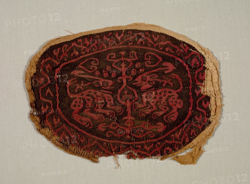 Two Confronted Animals from a Tunic, 700s-800s. Egypt, Islamic period, Abbasid, 8th - 9th century. Plain weave with slit-tapestry weave, applied; dyed wool, undyed linen; overall: 13 x 18.5 cm (5 1/8 x 7 5/16 in.)