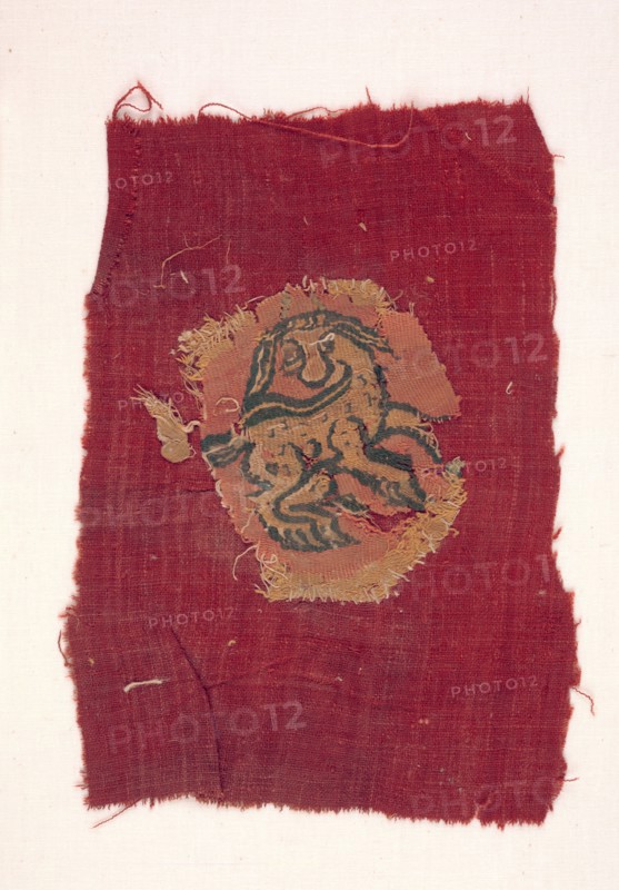 Fragment of an Oval Segmentum, 600s - 700s. Egypt, 7th - 8th century. Tapestry (originally inwoven in tabby ground); linen and wool; overall: 9.8 x 8.8 cm (3 7/8 x 3 7/16 in.).