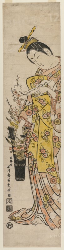 Courtesan Reading a Poem Slip Tied to Flowers in a Vase, mid-1740s. Ishikawa Toyonobu (Japanese, 1711-1785). Color woodblock print; overall: 69.5 x 16.5 cm (27 3/8 x 6 1/2 in.).