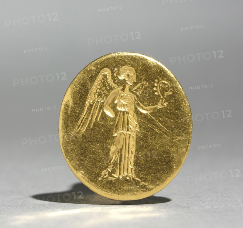 Finger Ring with Figure of Nike, 300s BC. Greece, 4th Century BC. Gold; diameter: 1.7 cm (11/16 in.); bezel: 2.2 x 2 cm (7/8 x 13/16 in.).