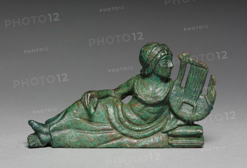 Vessel Ornament of Reclining Lyre-player, probably 400-375 BC. Italy, Etruscan, early 4th Century BC. Bronze with gilding traces; overall: 5.2 cm (2 1/16 in.).