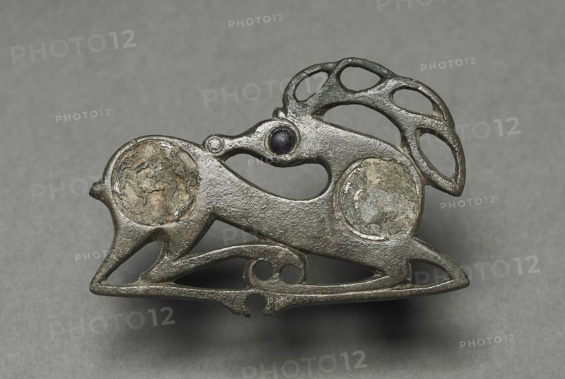 Fibula in the Form of a Recumbent Stag, c. 400. Northeastern Europe, 5th century. Bronze with glass inlay; overall: 3.1 x 4.8 cm (1 1/4 x 1 7/8 in.).